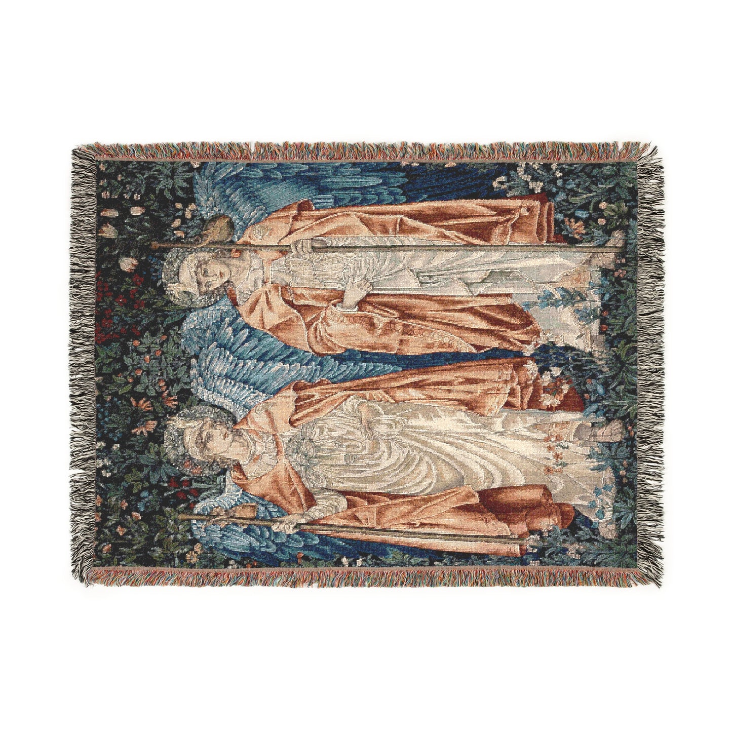 A woven blanket with a vintage floral design featuring artistic elements, in shades of blue, beige, and brown, with fringed edges.