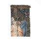 Decorative tapestry with angel design and broomstick on a white background