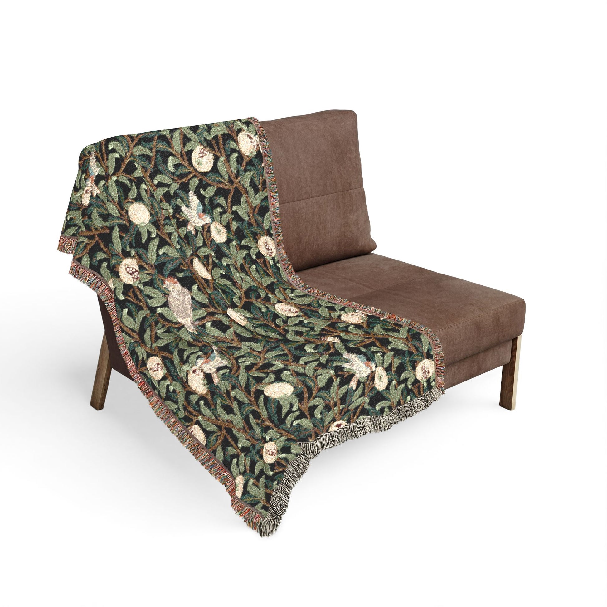 Brown chair with a green patterned throw blanket on a white background