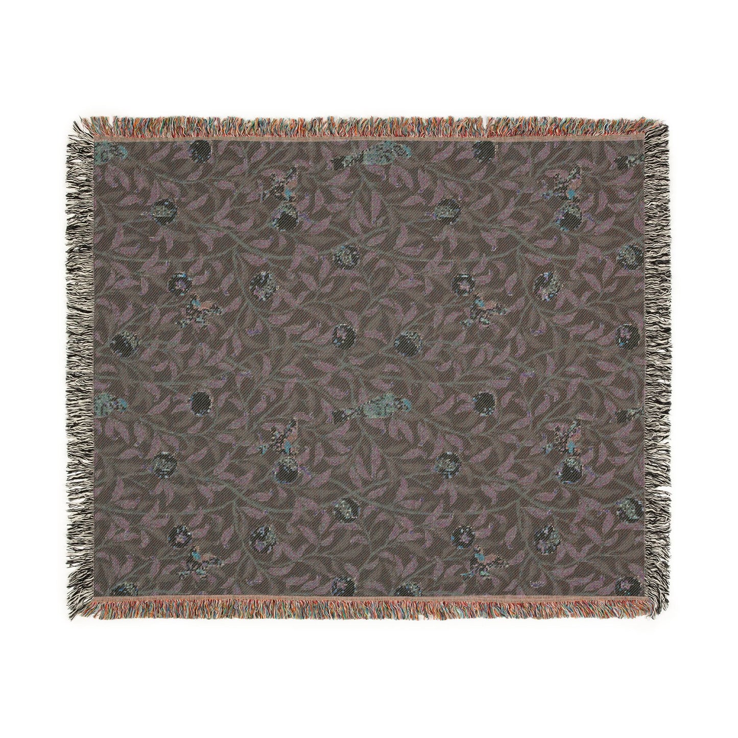 Patterned throw blanket with fringe on a white background