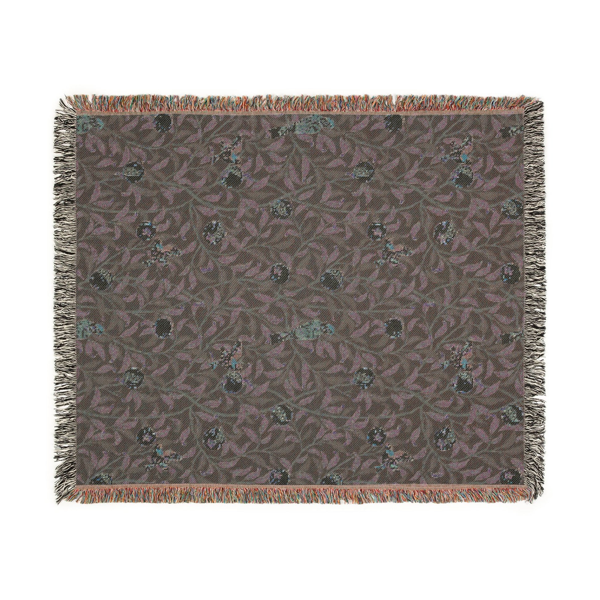Patterned throw blanket with fringe on a white background