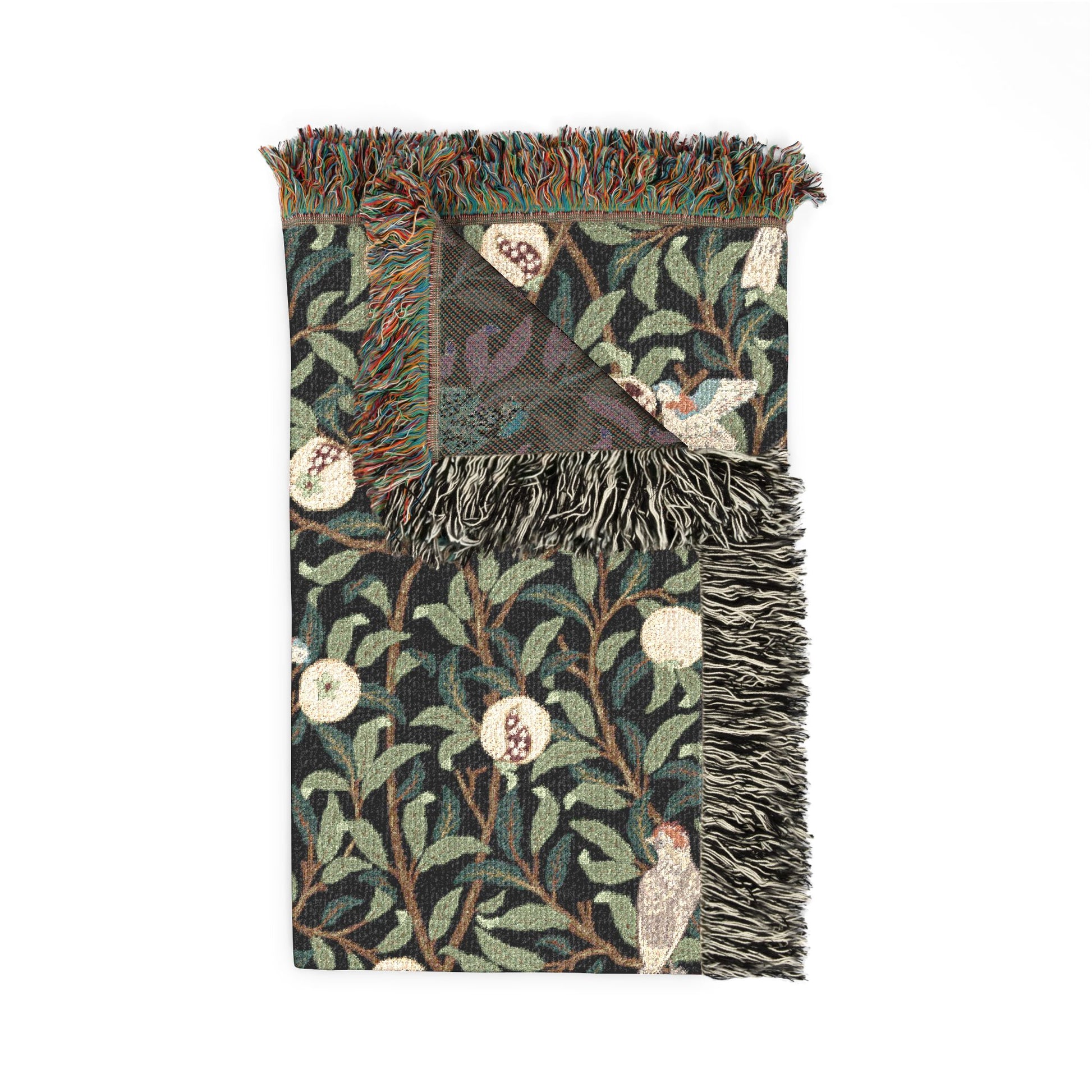 Decorative throw blanket with nature-themed pattern on a white background