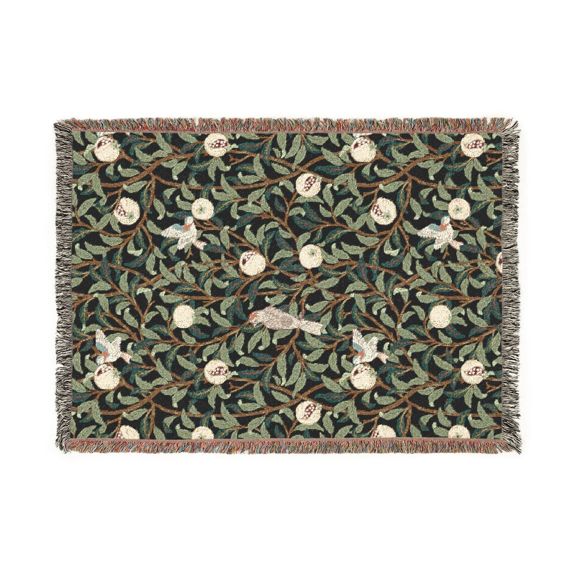Decorative woven blanket with floral and bird pattern on a white background