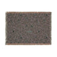 Patterned rug with fringe on a white background