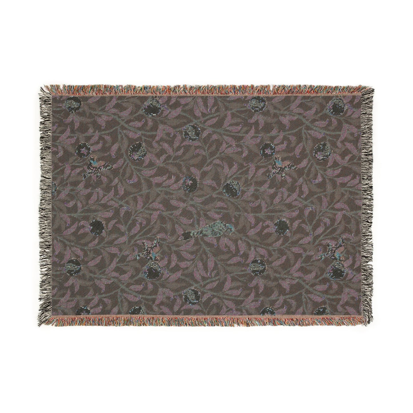 Patterned rug with fringe on a white background