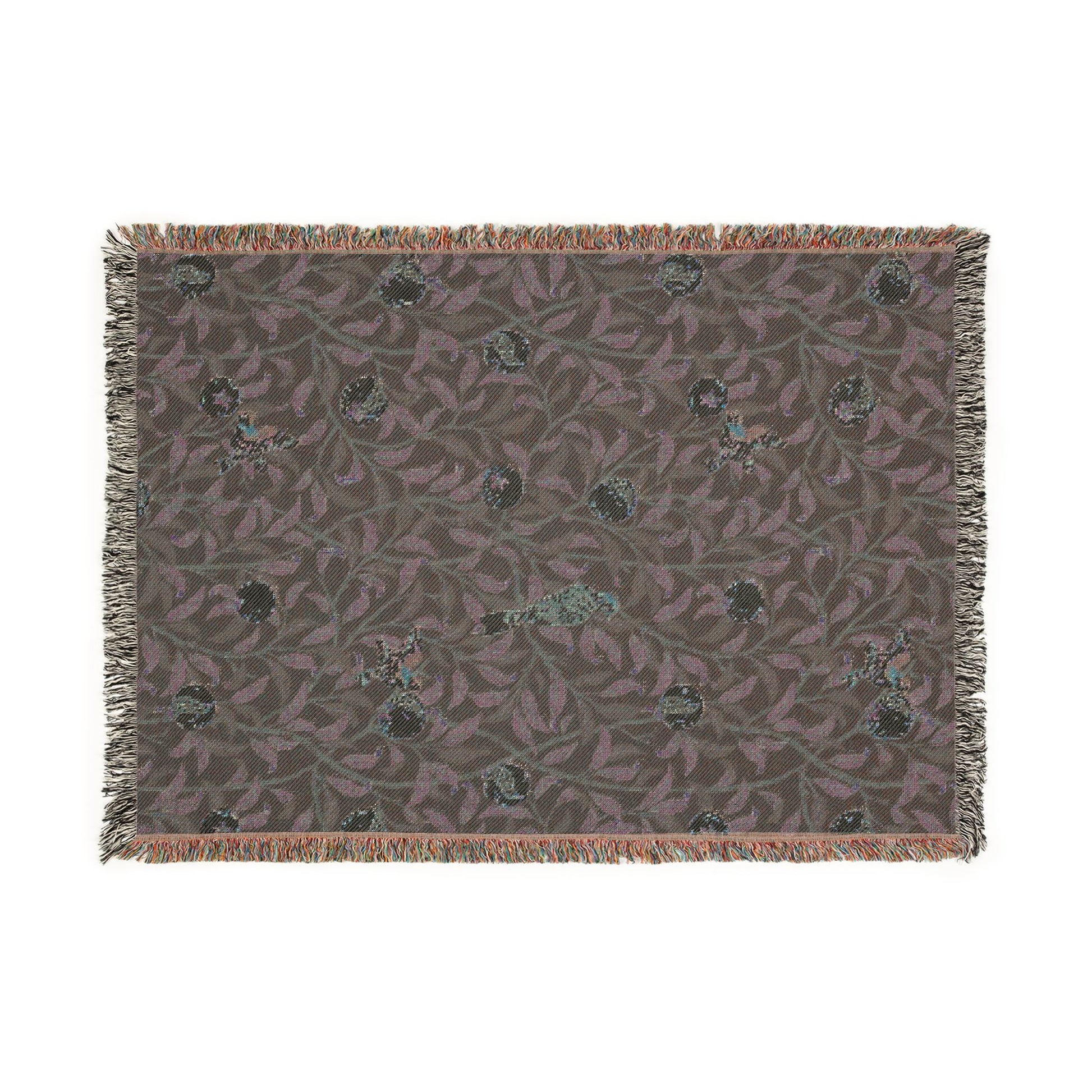 Patterned rug with fringe on a white background