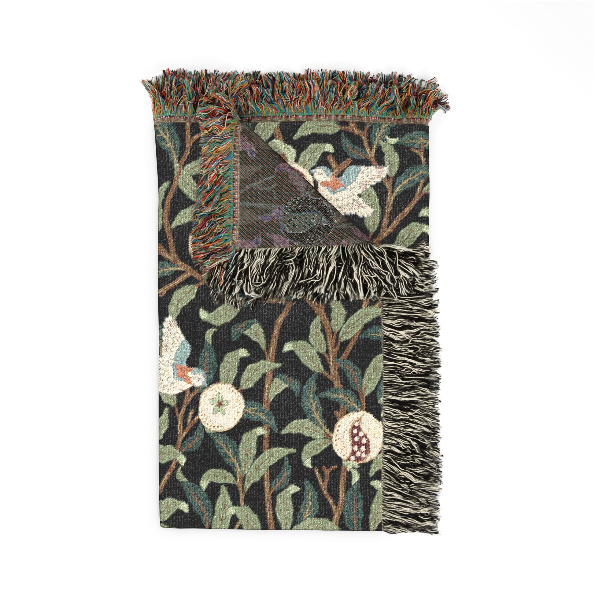 Decorative throw blanket with nature-themed pattern on a white background