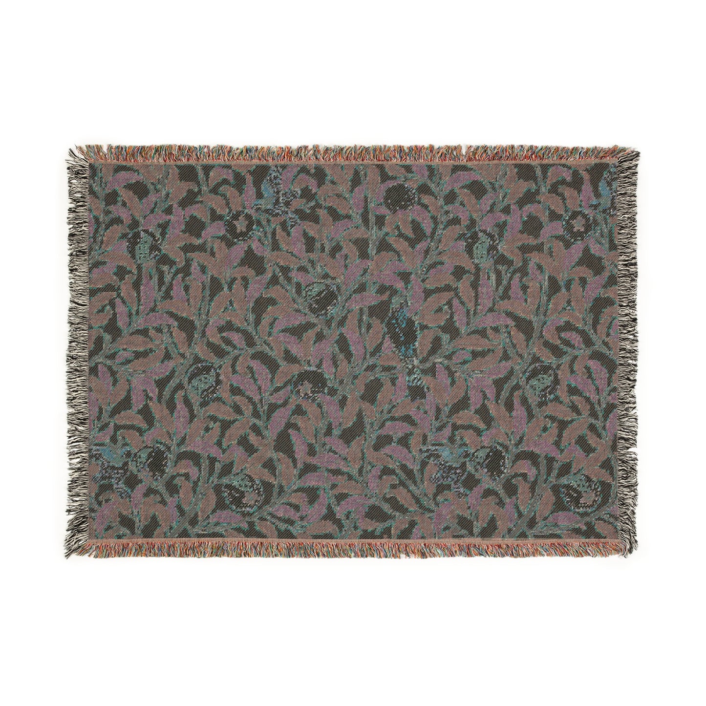 A woven cotton blanket with a floral William Morris & Co pattern in shades of green and beige, featuring birds and pomegranate motifs, with a colourful fringed edge.