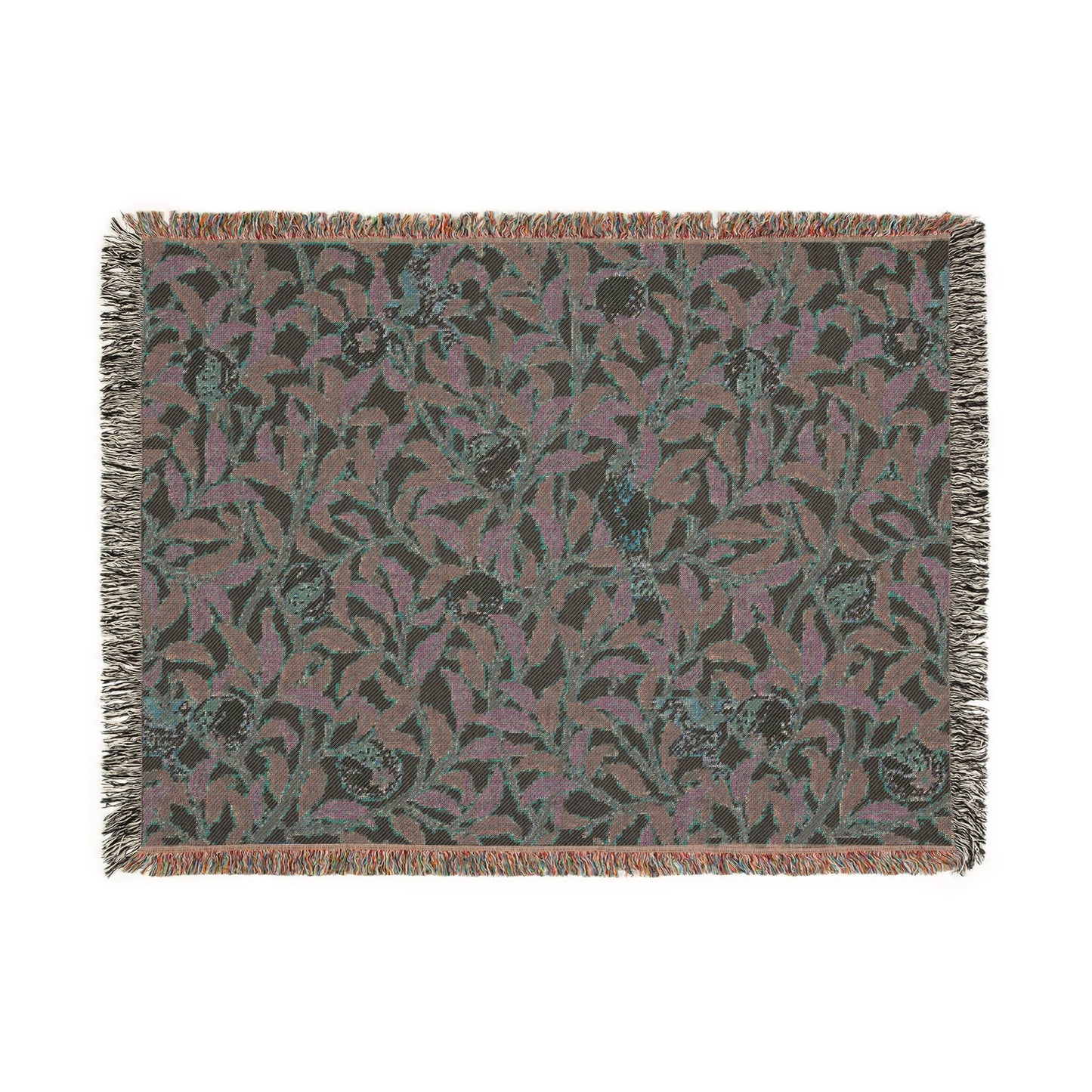 A woven cotton blanket with a floral William Morris & Co pattern in shades of green and beige, featuring birds and pomegranate motifs, with a colourful fringed edge.