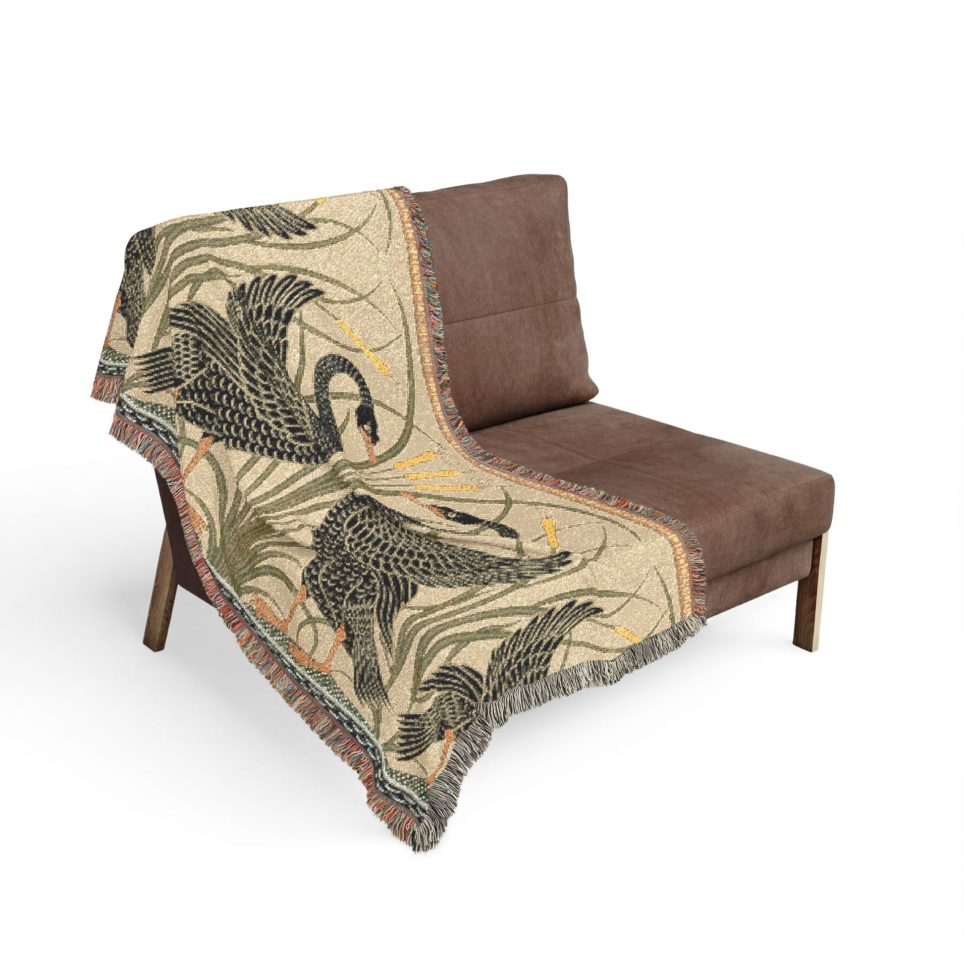 Brown chair with a decorative blanket featuring swan designs on a white background
