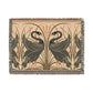 A woven cotton blanket with a geometric pattern featuring birds, in beige, black, and green colors, with fringed edges.