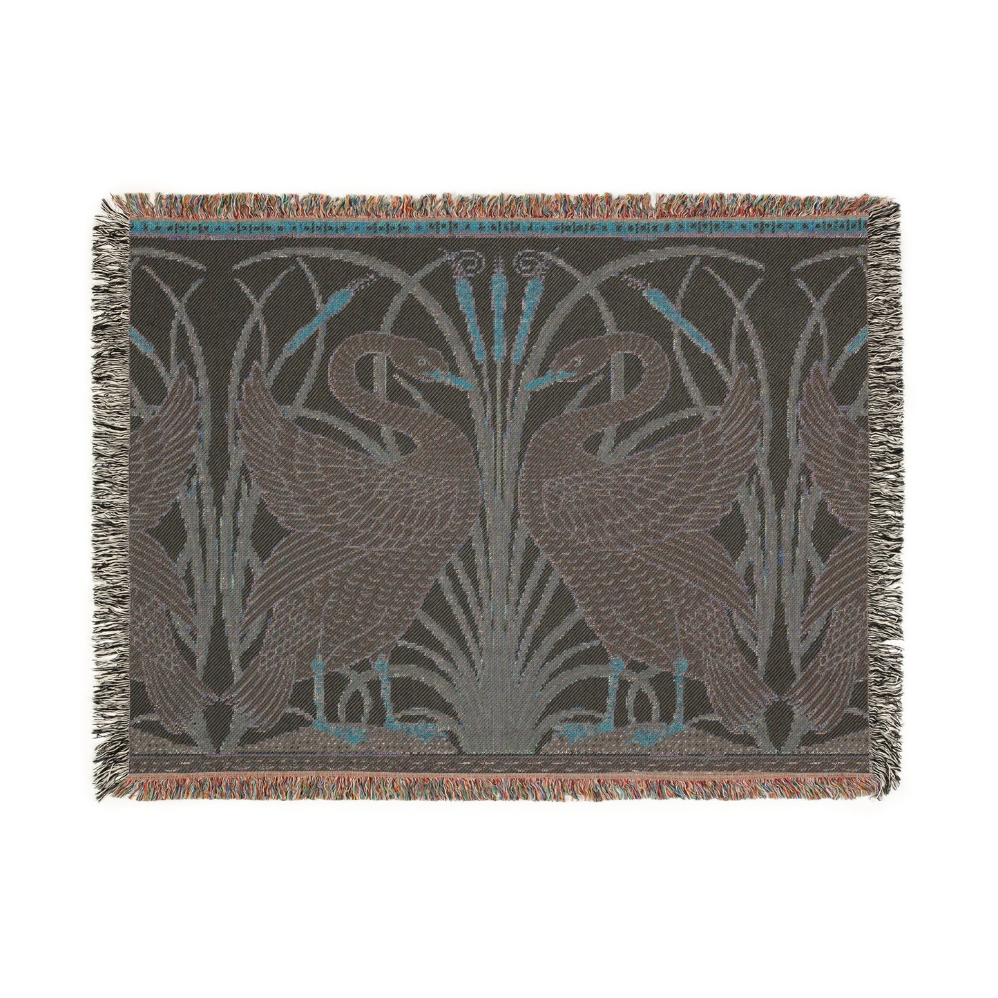 A woven cotton blanket with a geometric William Morris & Co pattern featuring birds, in beige, black, and green colours, with fringed edges.