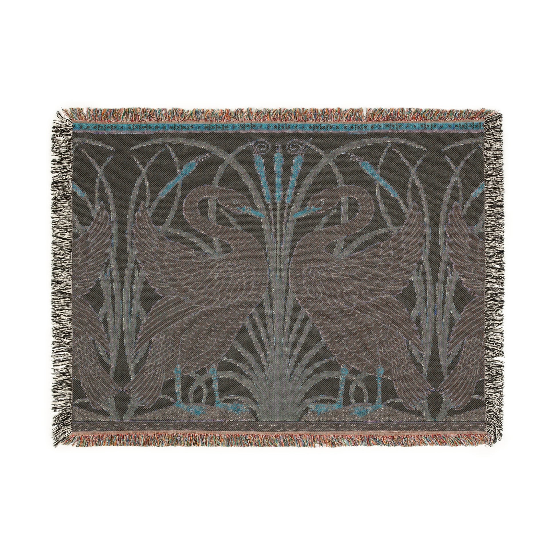 A woven cotton blanket with a geometric William Morris & Co pattern featuring birds, in beige, black, and green colours, with fringed edges.