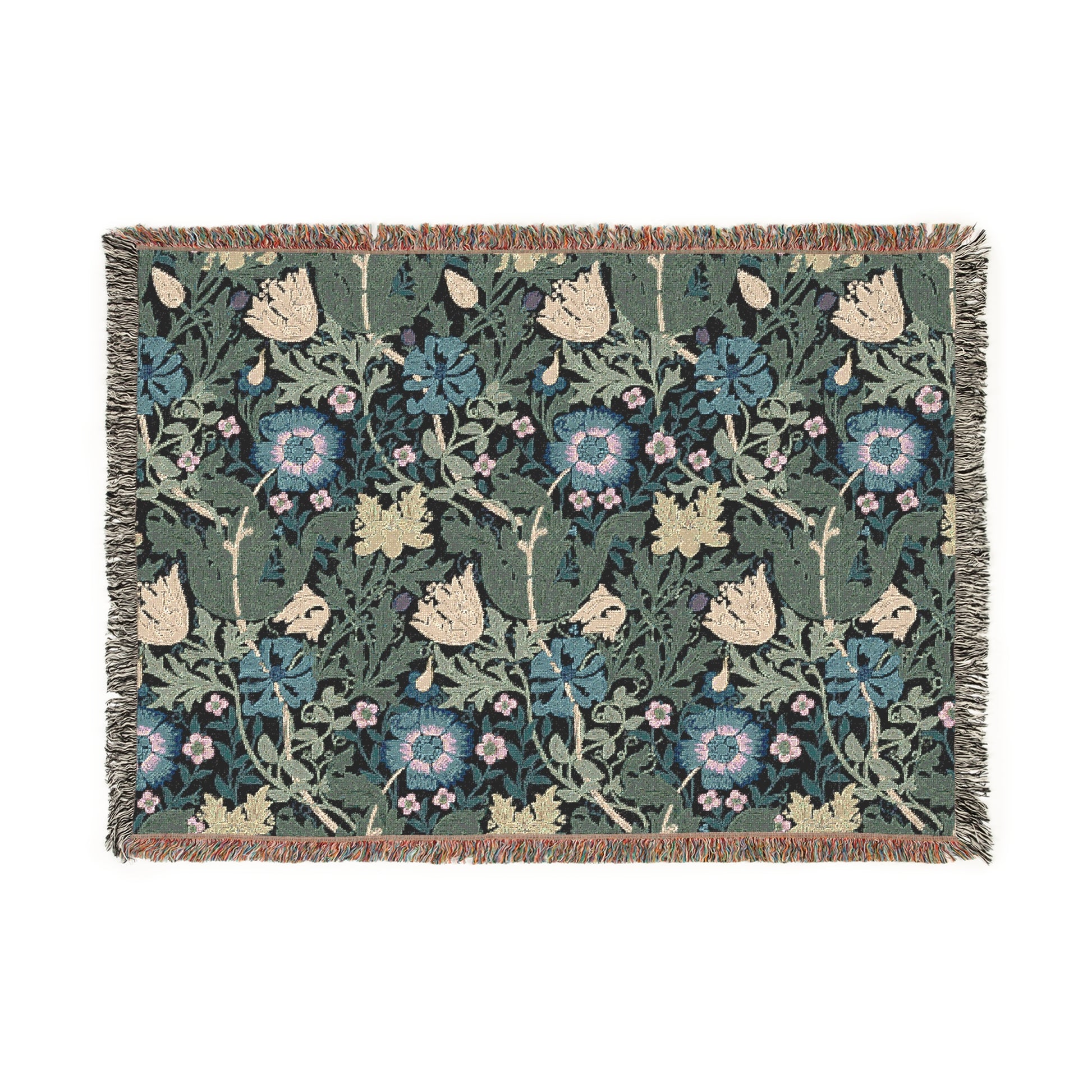 A woven cotton blanket with a floral William Morris & Co pattern in blue, green, and beige colours, featuring fringed edges.