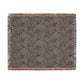 Floral patterned throw blanket with fringe on a white background