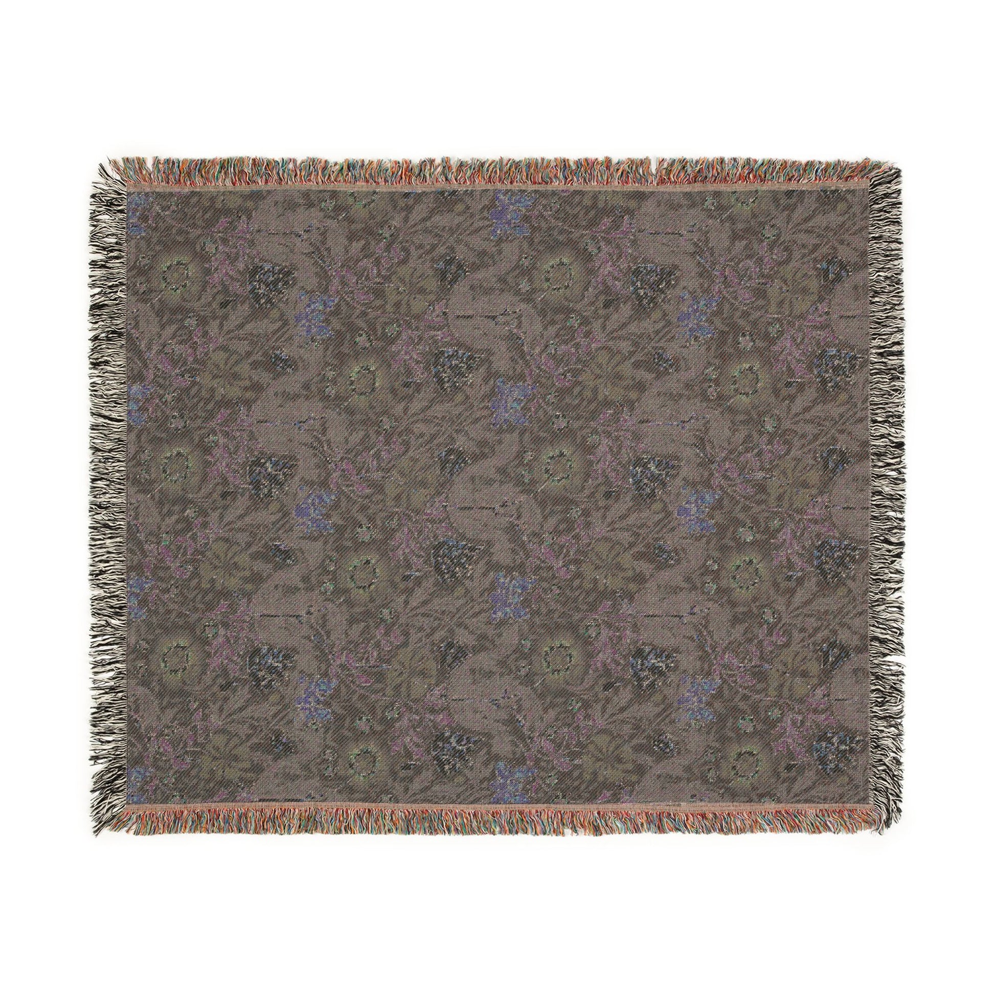 Floral patterned throw blanket with fringe on a white background