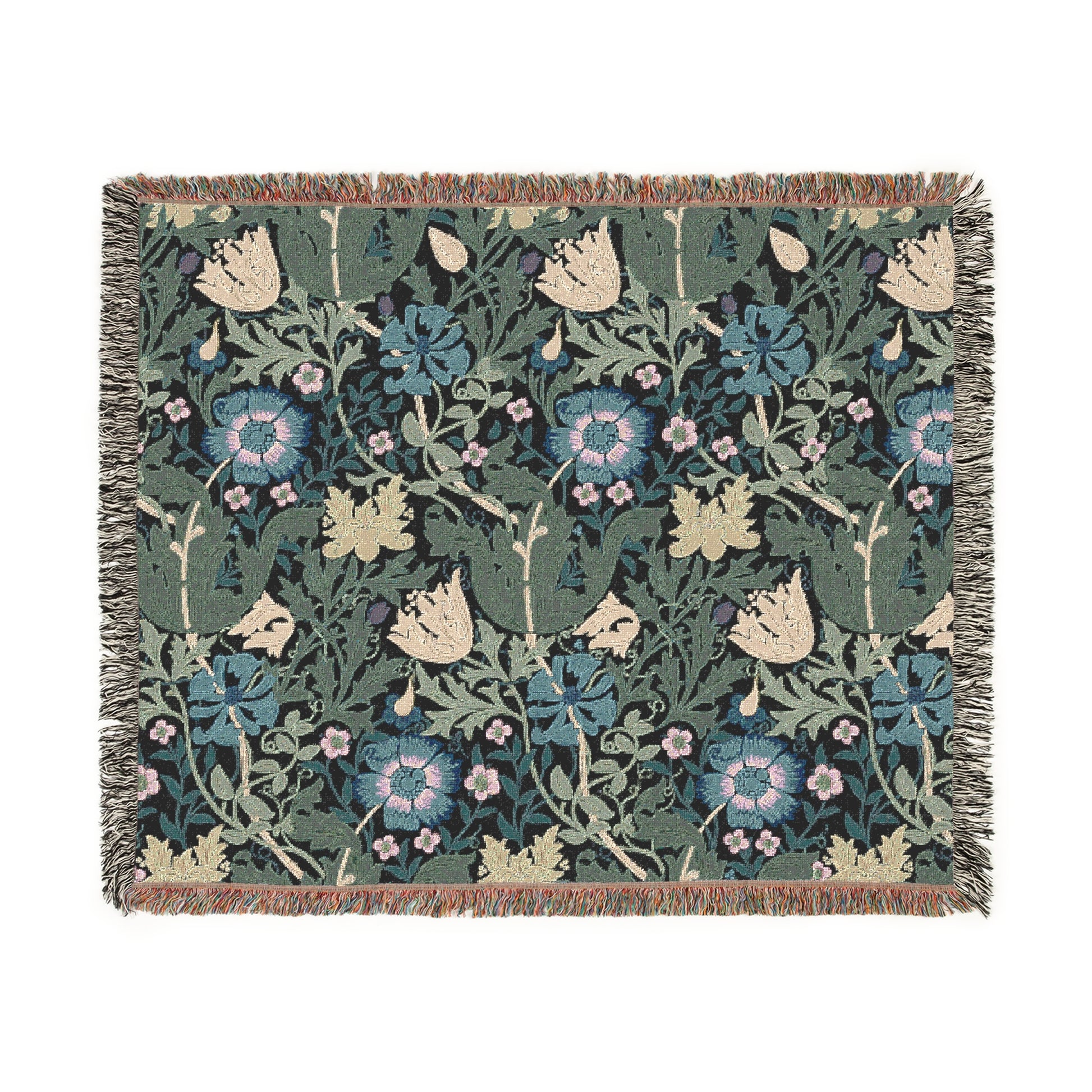 A woven cotton blanket with a floral pattern in blue, green, and beige colors, featuring fringed edges.