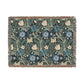 A woven cotton blanket with a floral pattern in blue, green, and beige colors, featuring fringed edges.