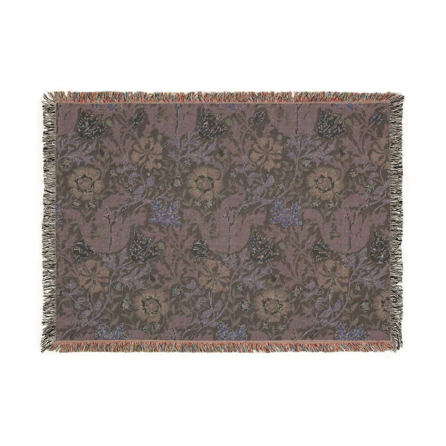 A woven cotton blanket with a floral William Morris & Co pattern in blue, green, and beige colours, featuring fringed edges.