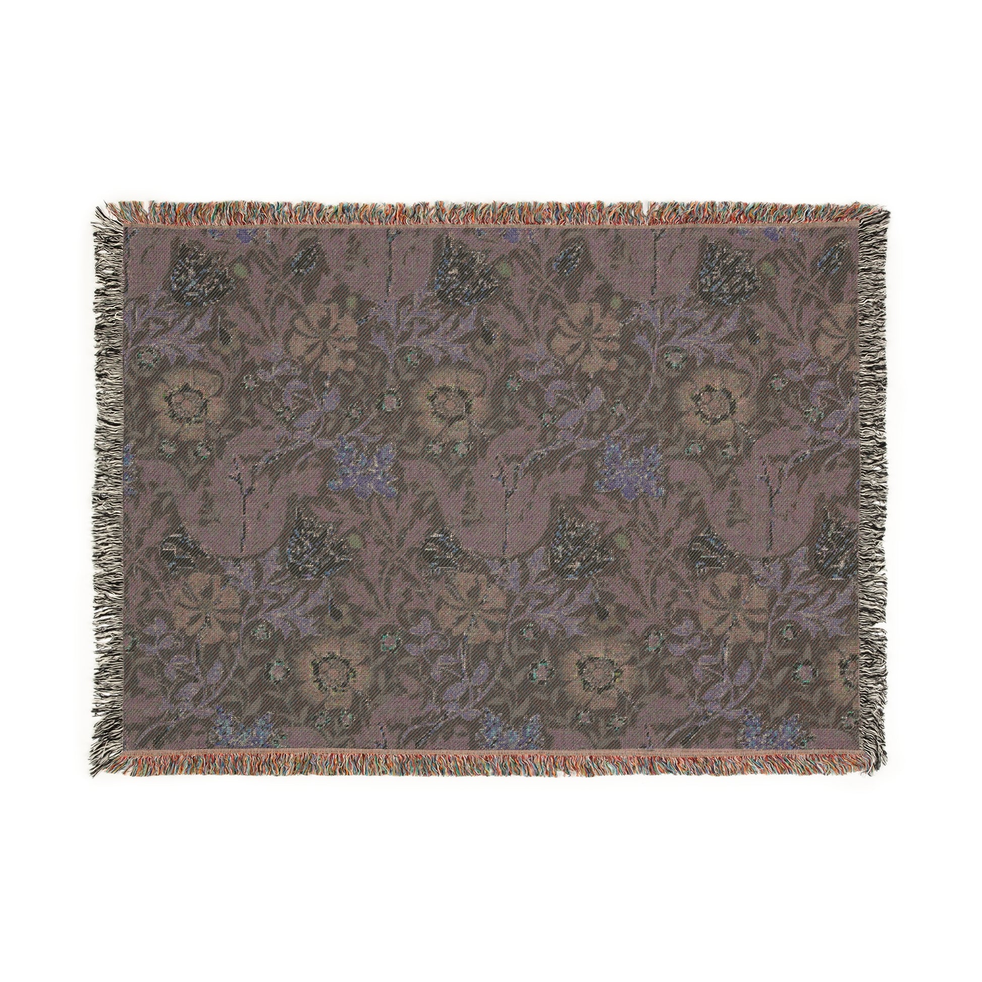A woven cotton blanket with a floral William Morris & Co pattern in blue, green, and beige colours, featuring fringed edges.