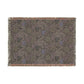 Decorative throw blanket with a floral pattern on a white background