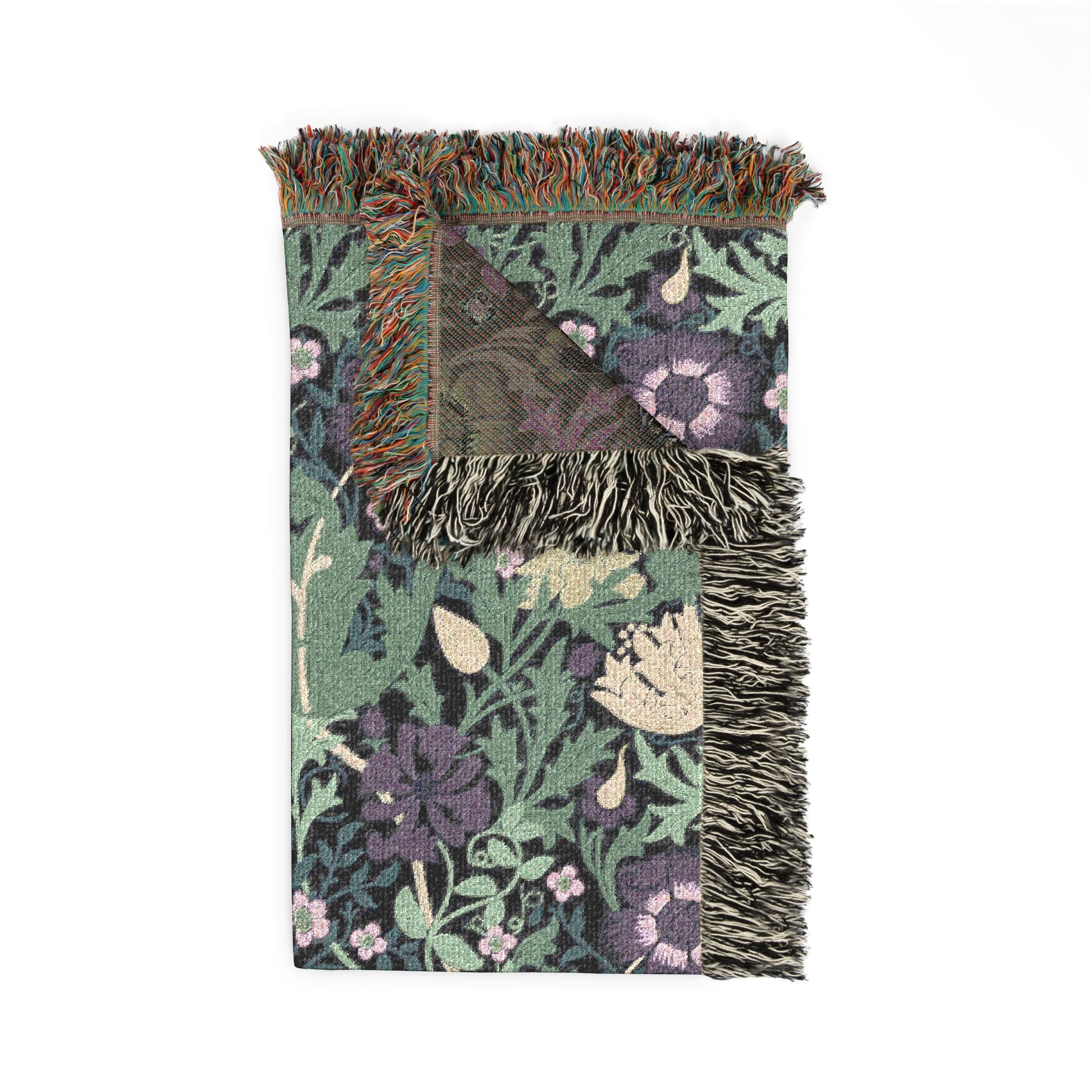 Floral patterned throw blanket with fringe on a white background