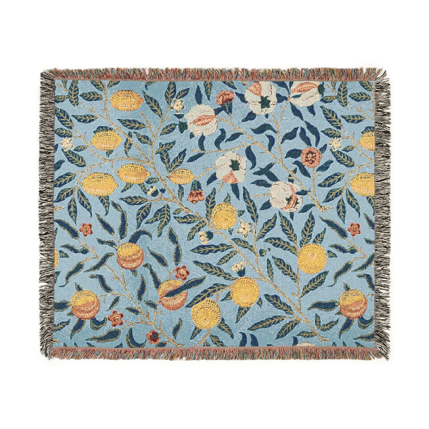 A woven cotton blanket with a floral pattern in shades of blue and yellow, featuring colorful fruit motifs and a fringed edge.