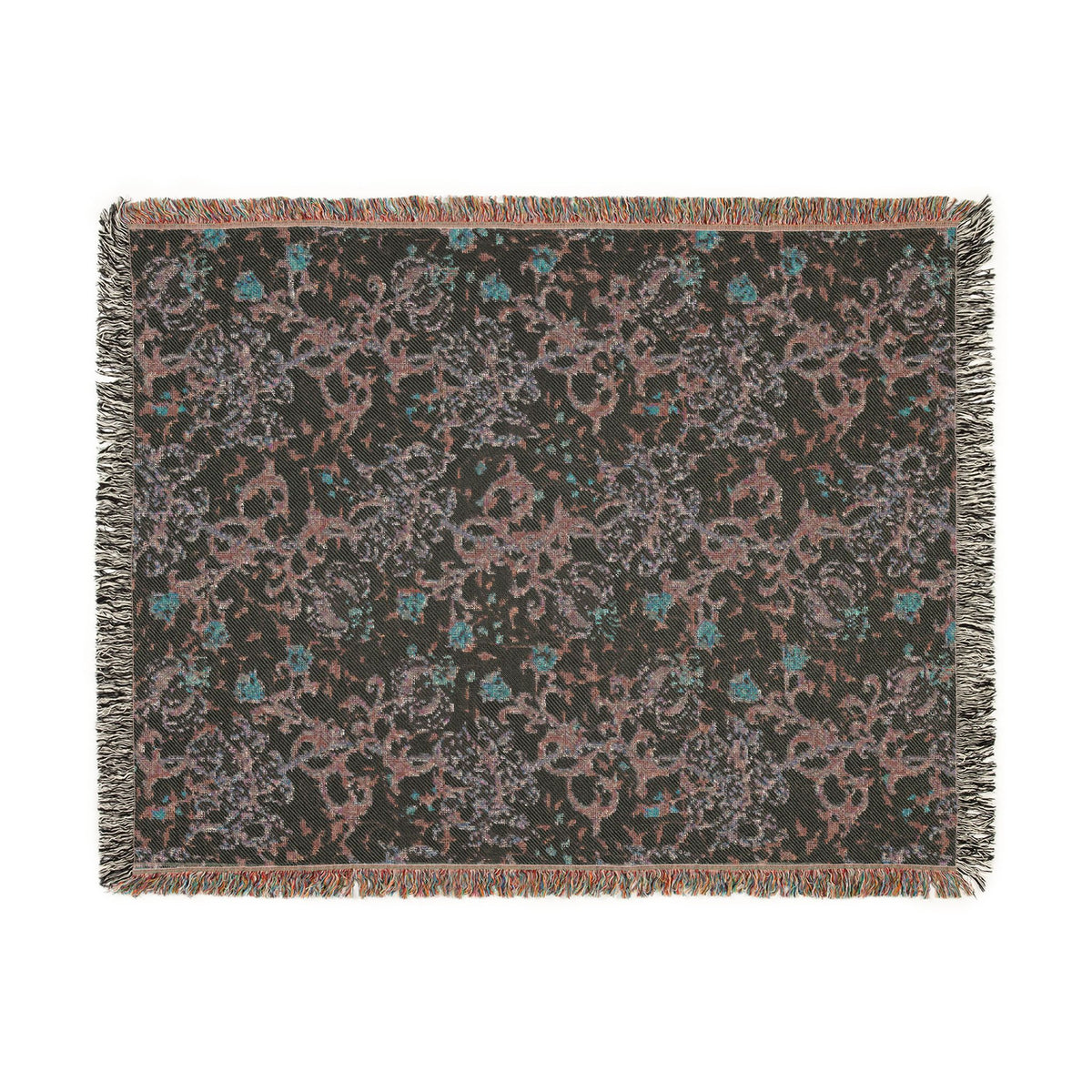 A rectangular woven throw blanket with fringe on all sides, featuring an abstract distressed pattern in dusty pink, teal blue, and light gray on a dark charcoal background.