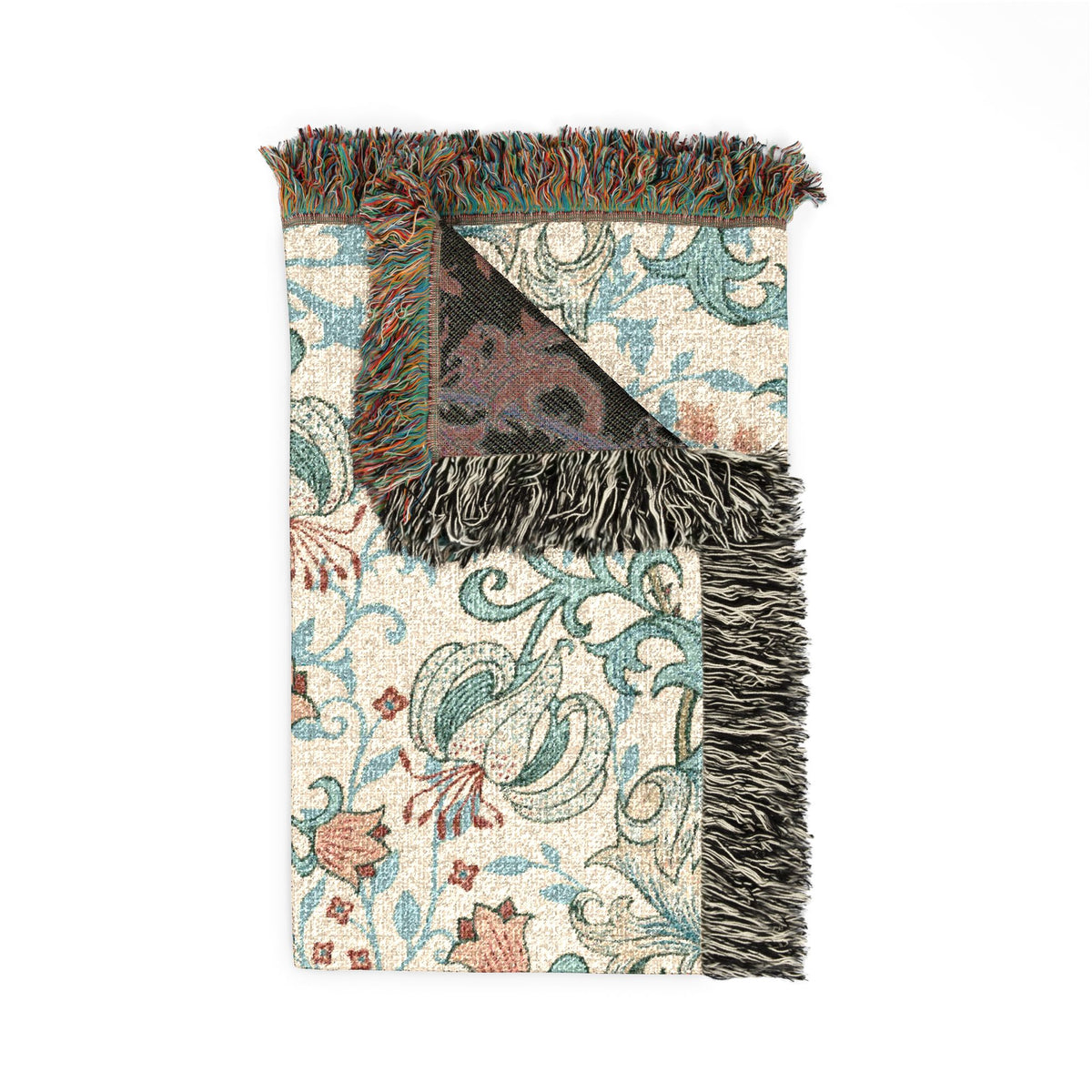 A folded woven throw blanket with a cream background, teal and rust floral scroll pattern, and dark charcoal fringe, shown on a plain white background.