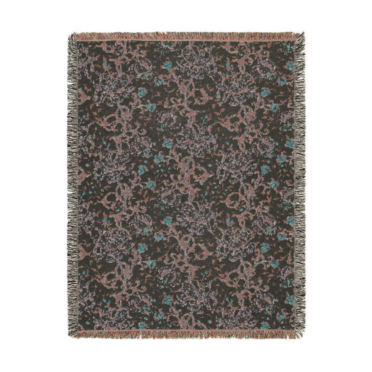 A rectangular woven throw blanket with fringed edges, featuring an abstract pattern in dusty pink, teal blue, and light gray on a dark charcoal background.
