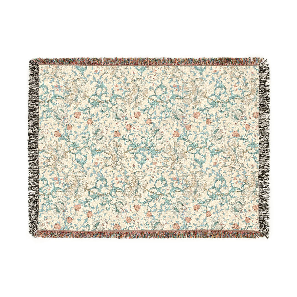 A rectangular woven throw blanket with a cream background and an intricate floral pattern in teal, rust orange, and beige. The blanket features fringed edges on all sides.