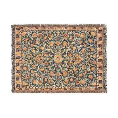 A woven cotton blanket with a geometric pattern in a mix of brown, beige, and blue colors, featuring colorful fringed edges.