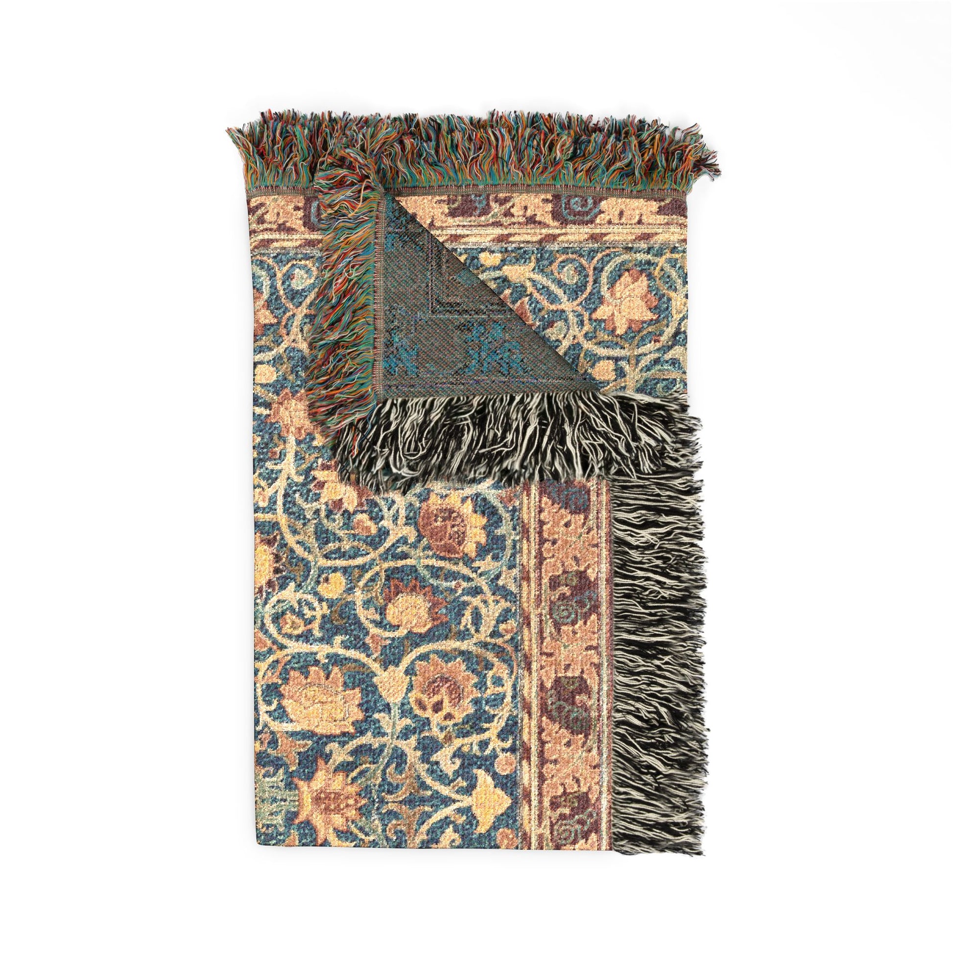 Decorative blanket with intricate patterns and fringes on a white background
