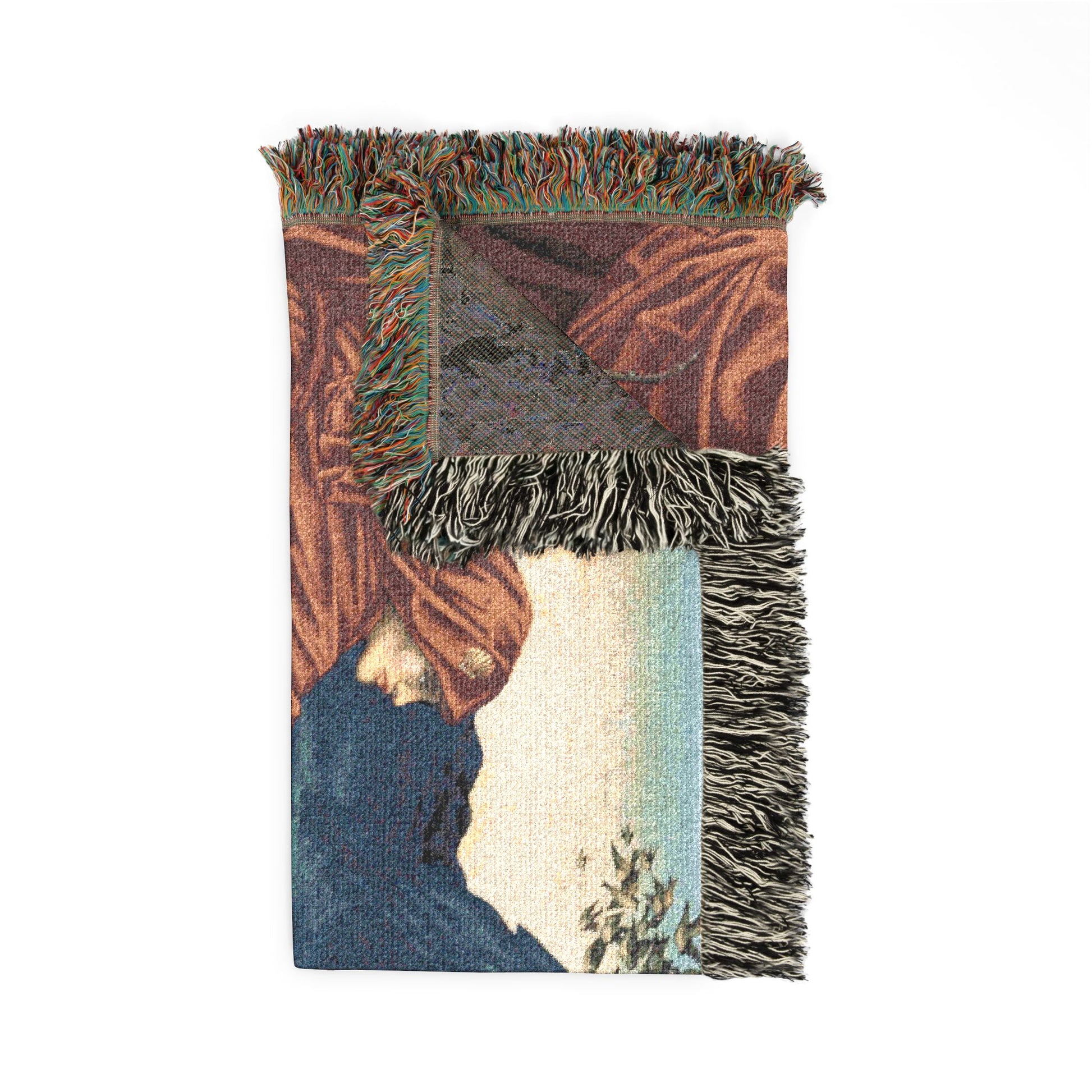 Textile with fringes featuring a landscape design on a white background