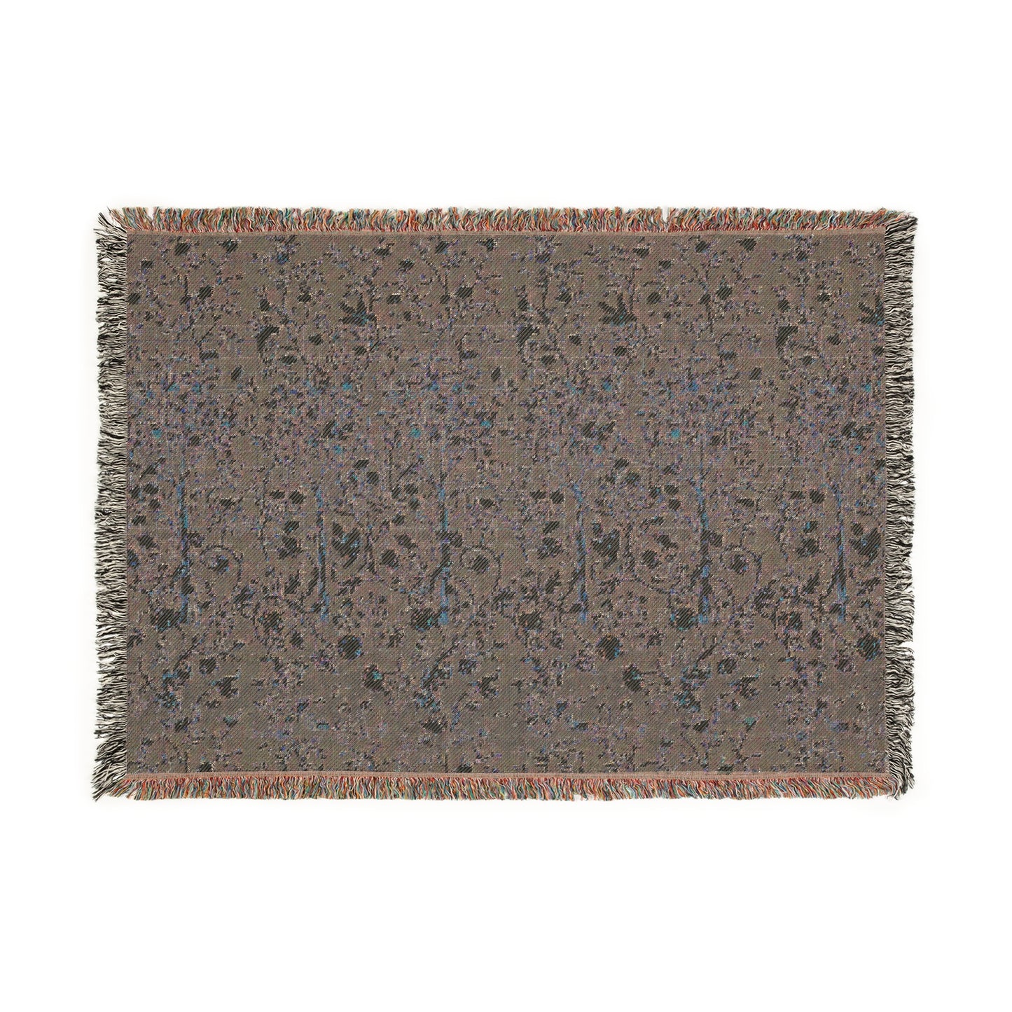 A woven cotton blanket with a geometric William Morris & Co pattern in evergreen teal colour, featuring a colourful fringed edge.