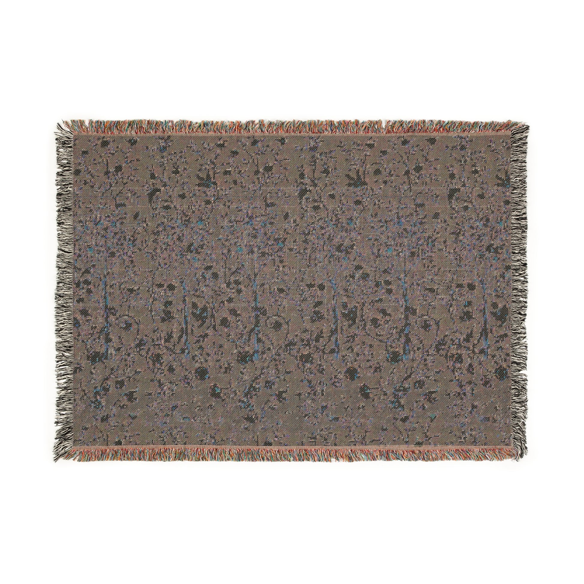 A woven cotton blanket with a geometric William Morris & Co pattern in evergreen teal colour, featuring a colourful fringed edge.