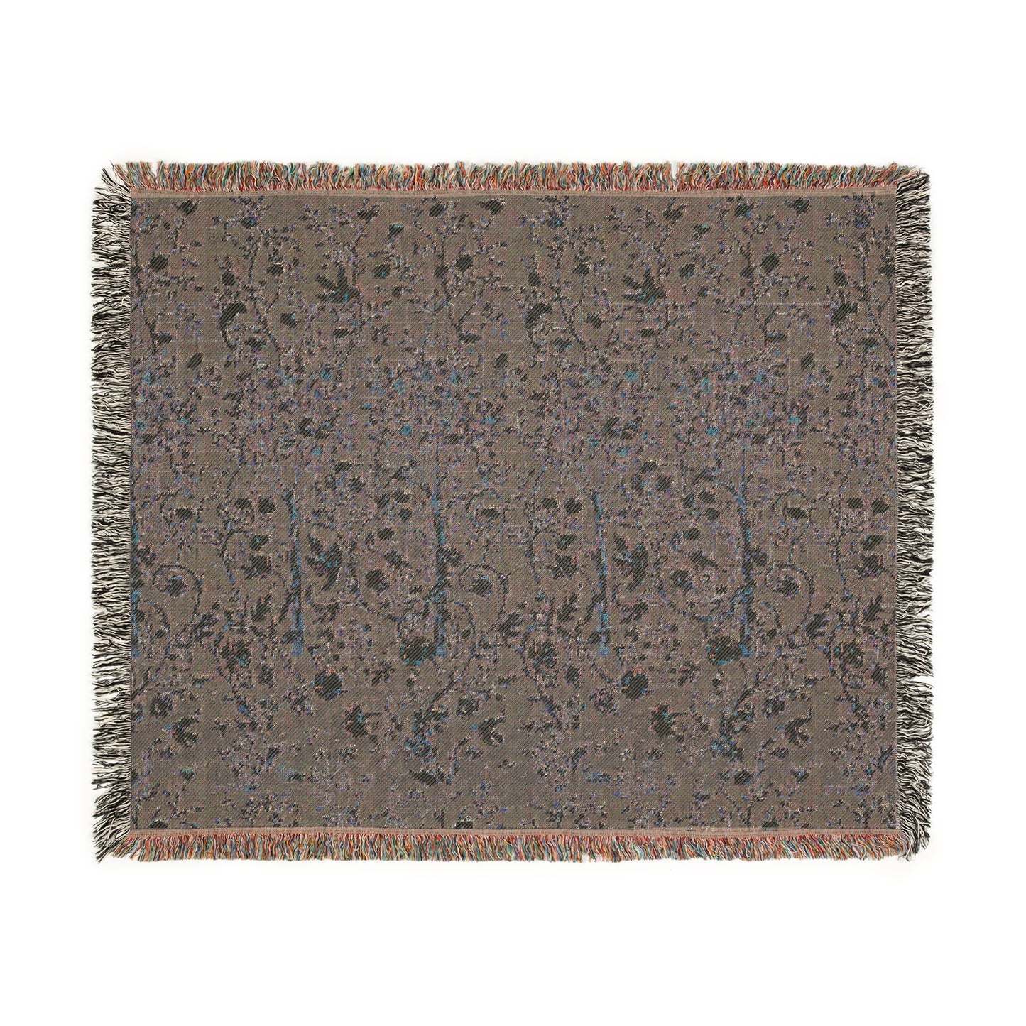 A woven cotton blanket with a geometric William Morris & Co pattern in evergreen teal colour, featuring a colourful fringed edge.