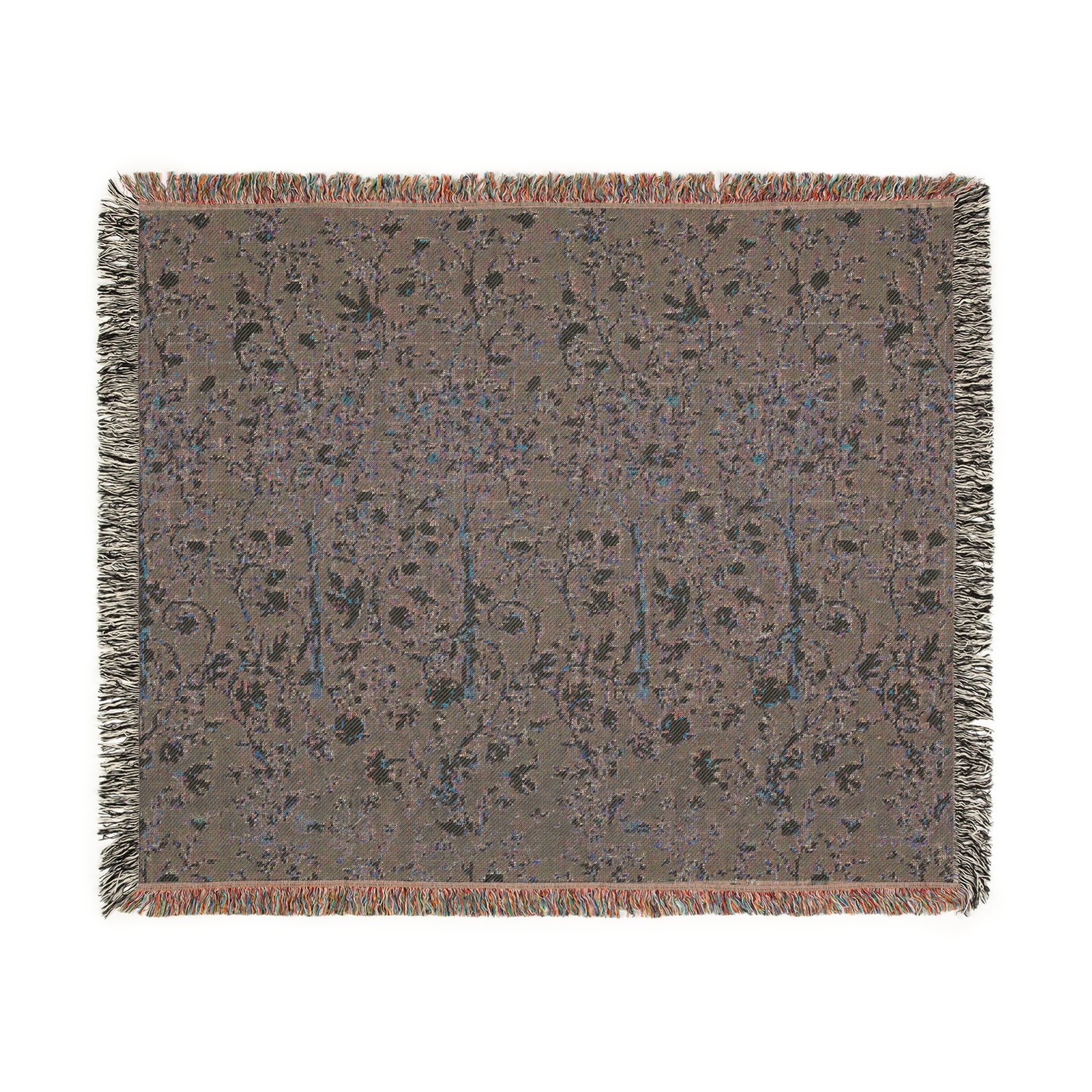 A woven cotton blanket with a geometric William Morris & Co pattern in evergreen teal colour, featuring a colourful fringed edge.