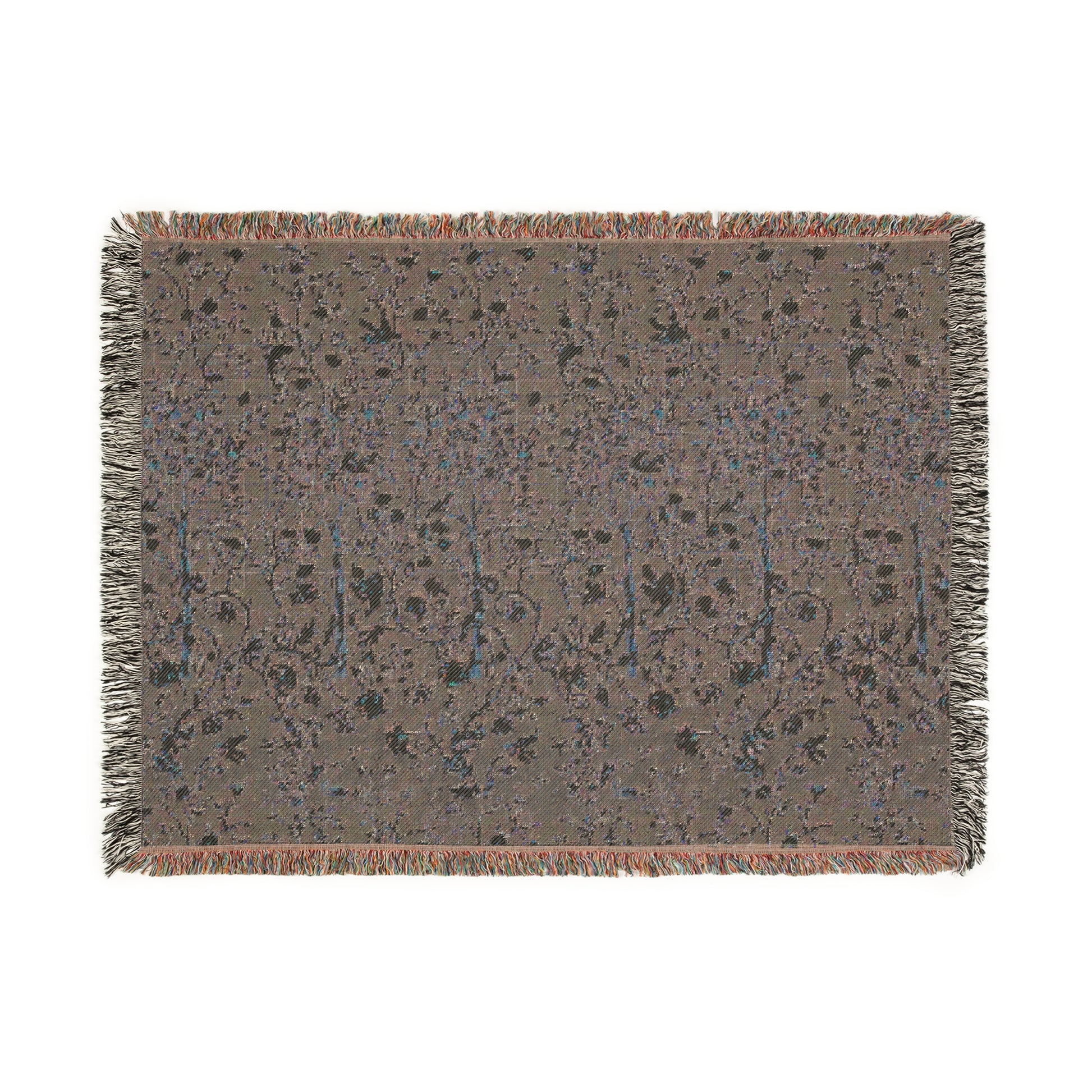 A woven cotton blanket with a geometric William Morris & Co pattern in evergreen teal colour, featuring a colourful fringed edge.