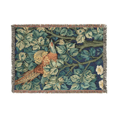 Decorative throw blanket with floral and bird pattern on a white background