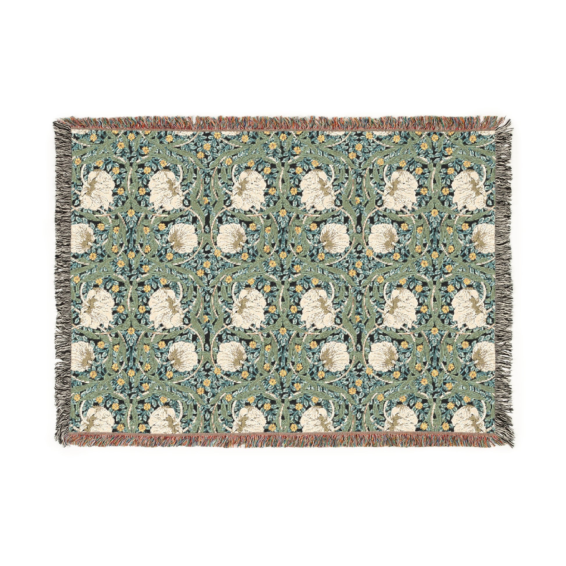 A woven cotton blanket with a green and William Morris & Co floral pattern, featuring a colourful fringed edge.