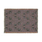Patterned throw blanket with fringe on a white background
