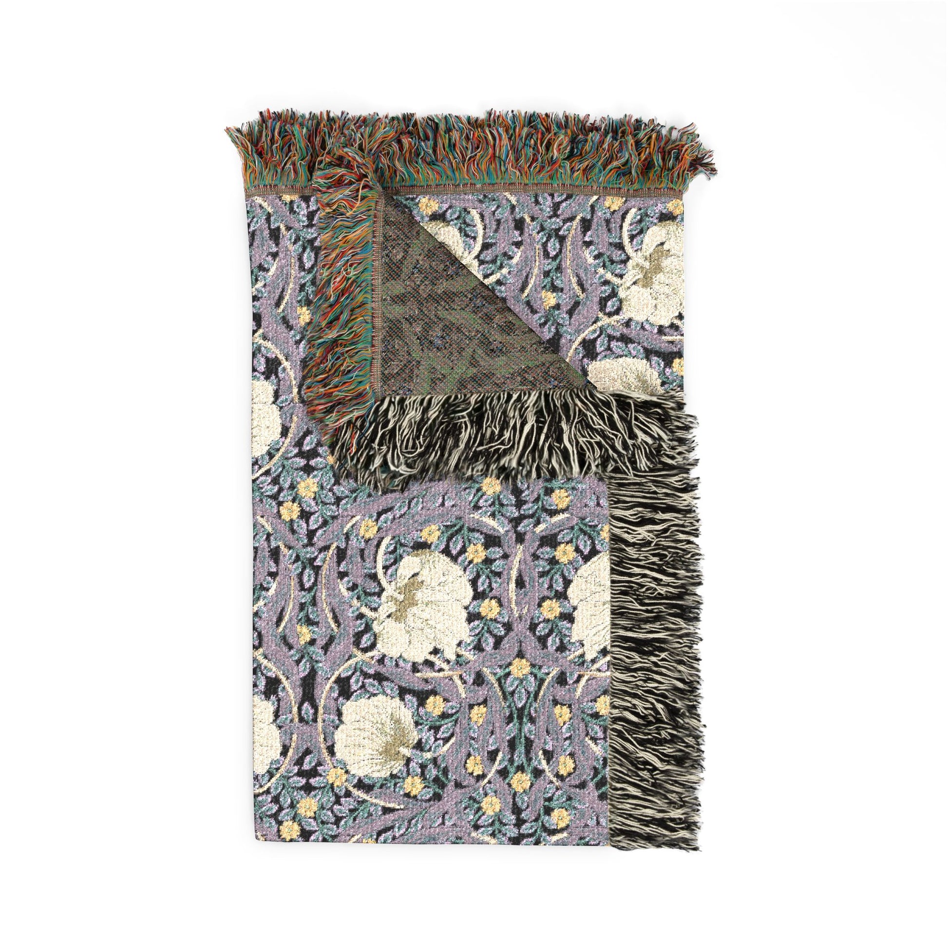 Decorative throw blanket with floral pattern and fringe on a white background