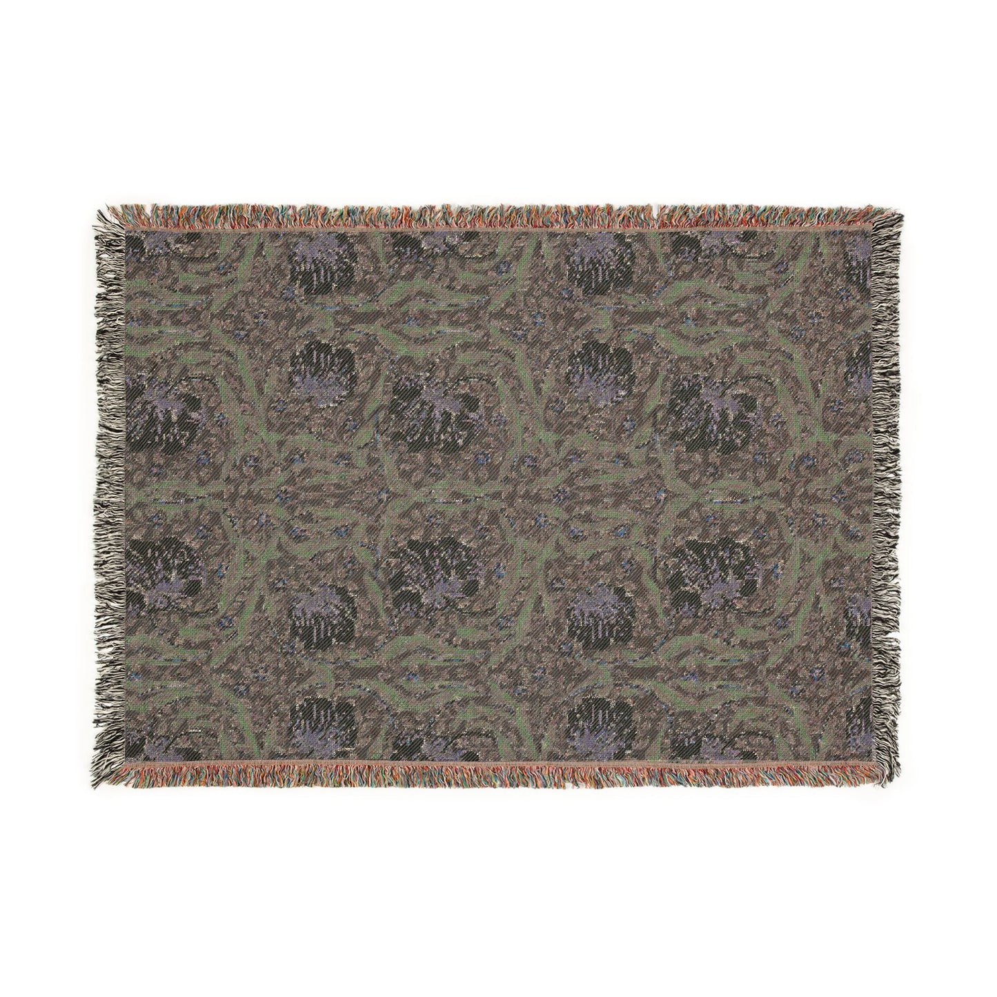 Patterned throw blanket with fringe on a white background