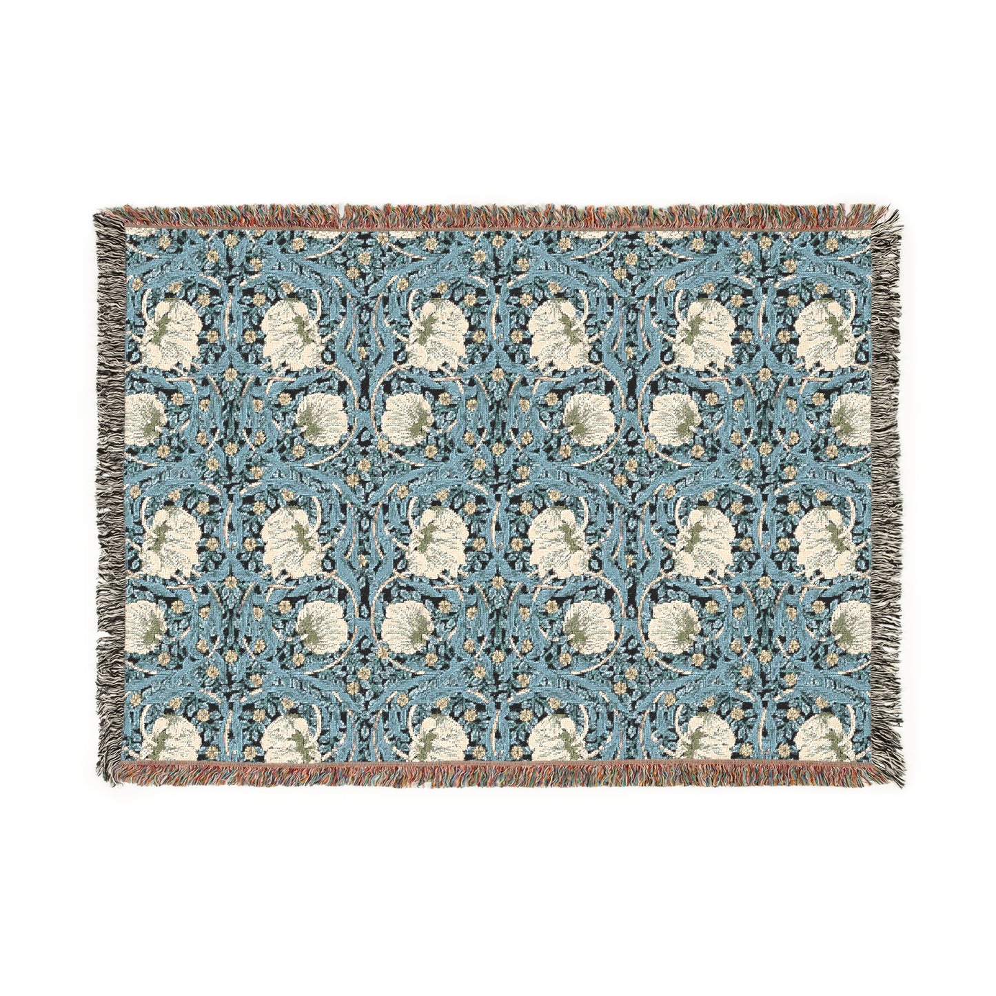 A woven cotton blanket with a geometric William Morris & Co pattern in shades of blue and beige, featuring colourful fringed edges.