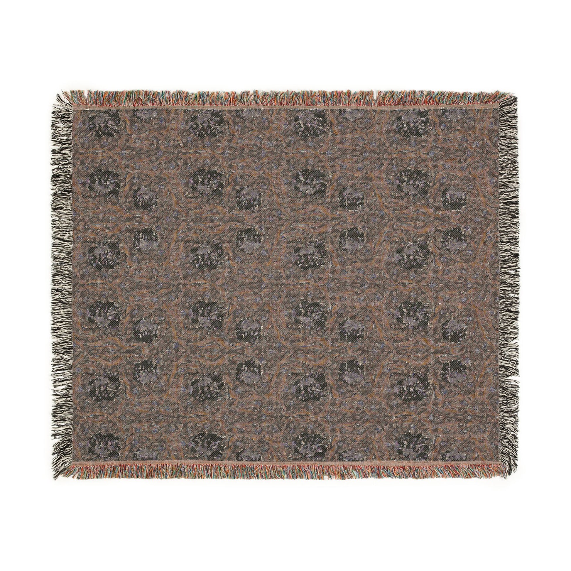 Patterned throw blanket with fringe on a white background
