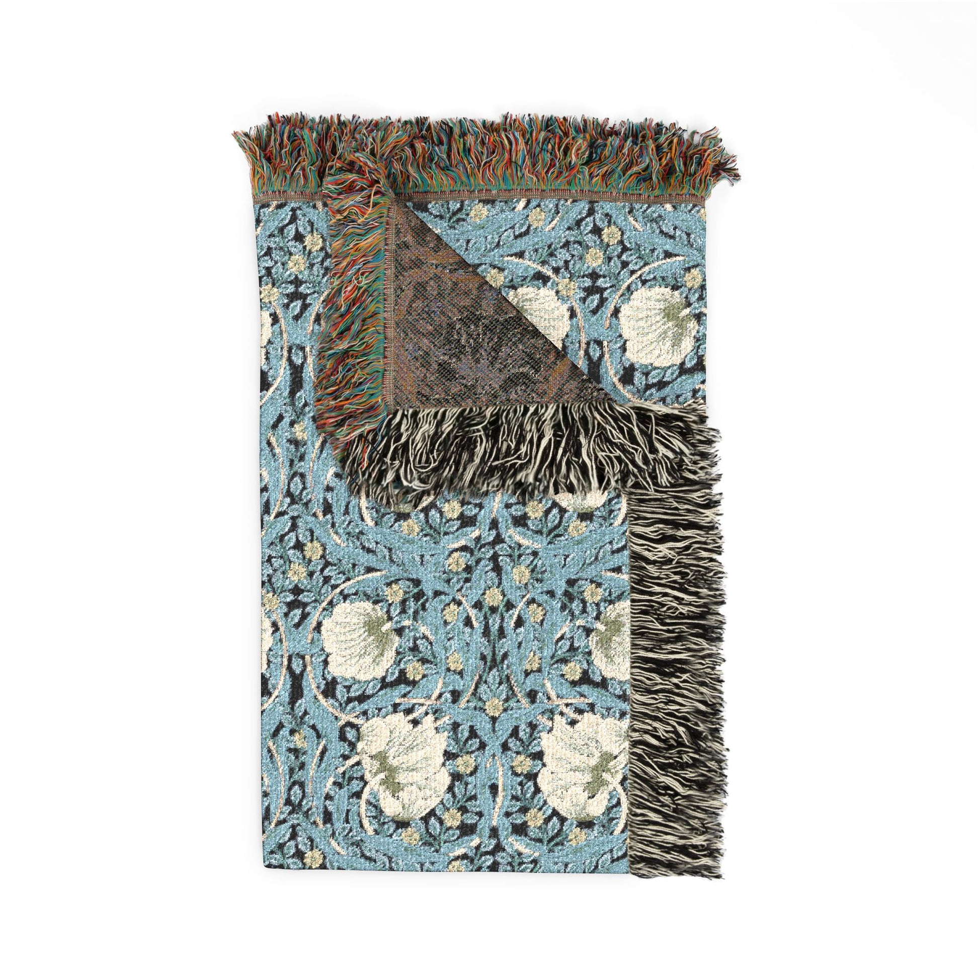 Decorative rug with floral pattern and fringed edge on a white background