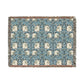 A woven cotton blanket with a geometric pattern in shades of blue and beige, featuring colorful fringed edges.