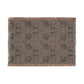 Patterned throw blanket with fringe on a white background