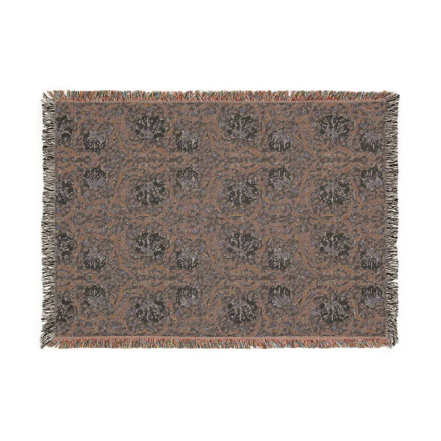 Patterned throw blanket with fringe on a white background